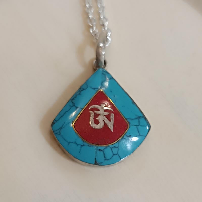 Colgante de plata y turquesa OM
