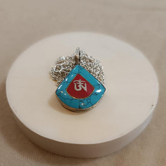 Colgante de plata y turquesa OM